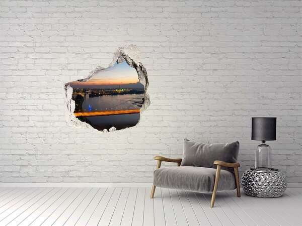 Fototapet 3D gaură în perete Vedere a orașului la apus