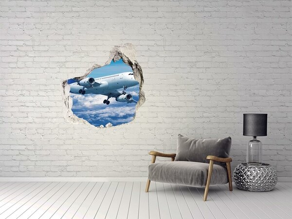 Autocolant gaură 3D Sosirea unui avion printre nori