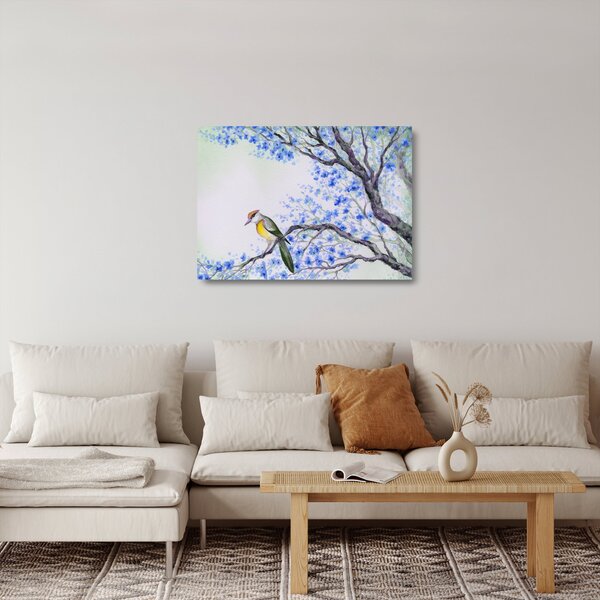 Tablou pe sticlă - Pasăre pe un copac cu flori albastre (70x50 cm)