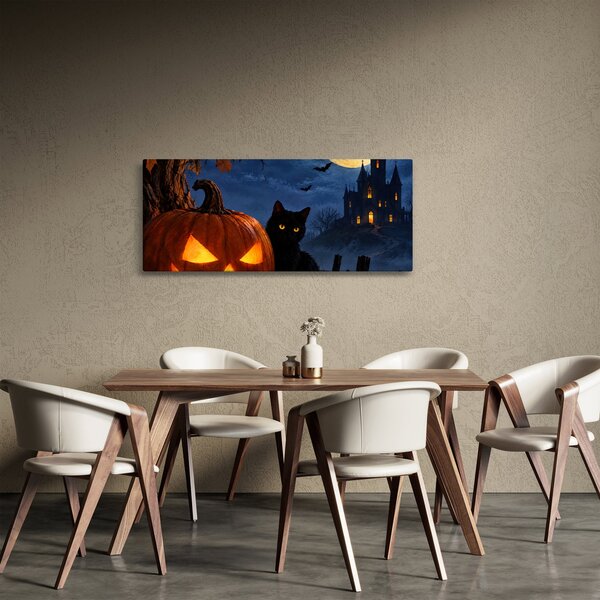 Tablou - Pisică neagră lângă un dovleac luminat de Halloween (120x50 cm)