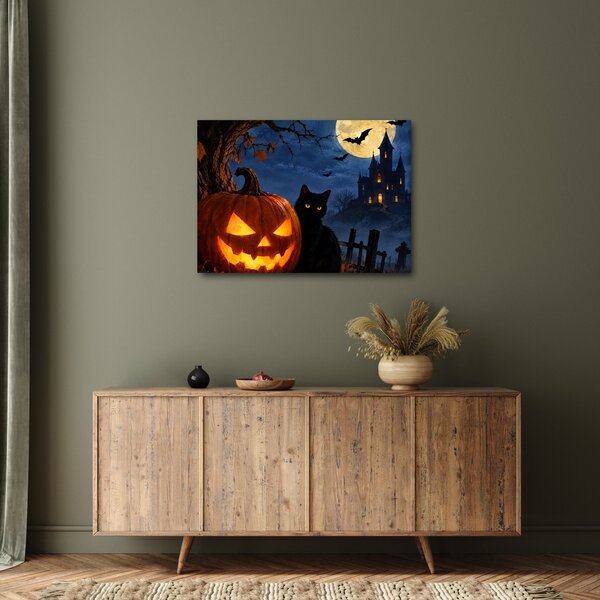 Tablou - Pisică neagră lângă un dovleac luminat de Halloween (70x50 cm)
