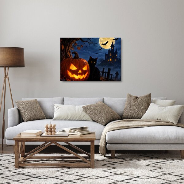 Tablou pe sticlă - Pisică neagră lângă un dovleac luminat de Halloween (70x50 cm)