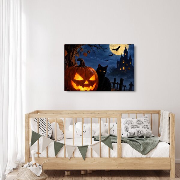 Tablou - Pisică neagră lângă un dovleac luminat de Halloween (90x60 cm)