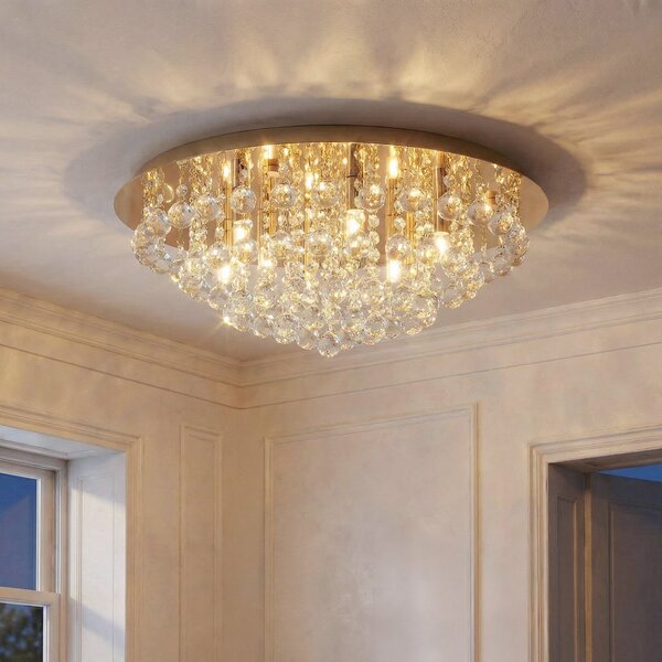 Lindby Plafonieră Gillion, 8 becuri, aur, cristal, Ø 55cm, reglabil, Auriu / Alamă, Camera de zi / sufragerie, Cristal, Modern