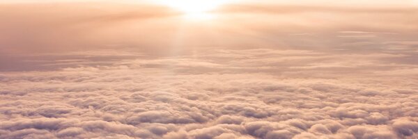 Tablou apus de soare prin geamul avionului