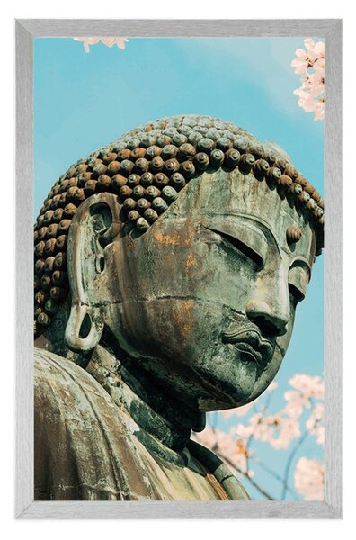 Poster statuia lui Buddha lângă cireș