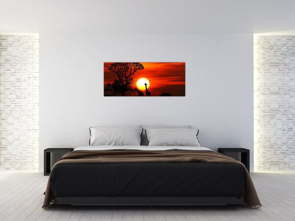 Tablou - Siluete animalelor la apus de soare (120x50 cm)