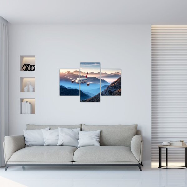 Tablou - Avion peste crestele montane (90x60 cm)