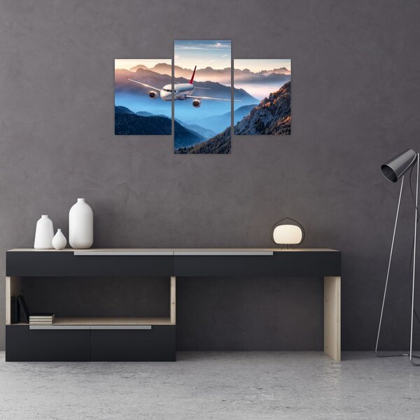 Tablou - Avion peste crestele montane (90x60 cm)