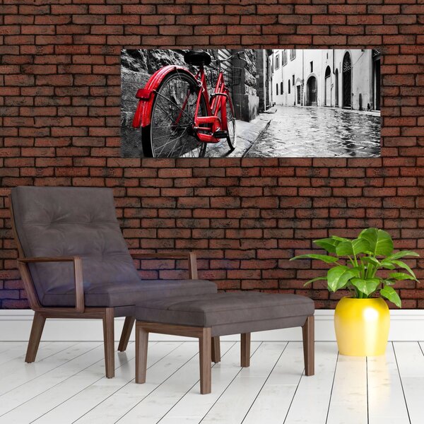 Tablou - Bicicleta roșie pe o stradă pavată (120x50 cm)