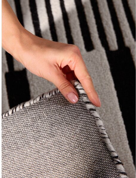 Covor alb-negru țesut manual din lână 120x180 cm Stryve Pulse – Elle Decoration