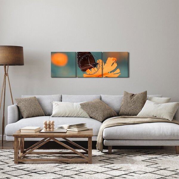 Tablou - fluture pe o floare portocalie (cu ceas) (90x30 cm)